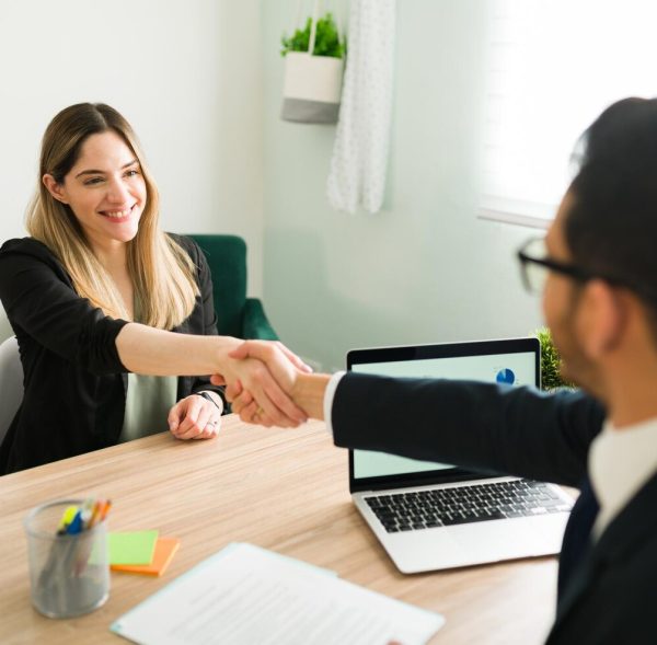 happy-caucasian-woman-shaking-hands-with-latin-man-business-meeting-with-lawyer-manager-hiring-beautiful-professional-woman-new-job_662251-184