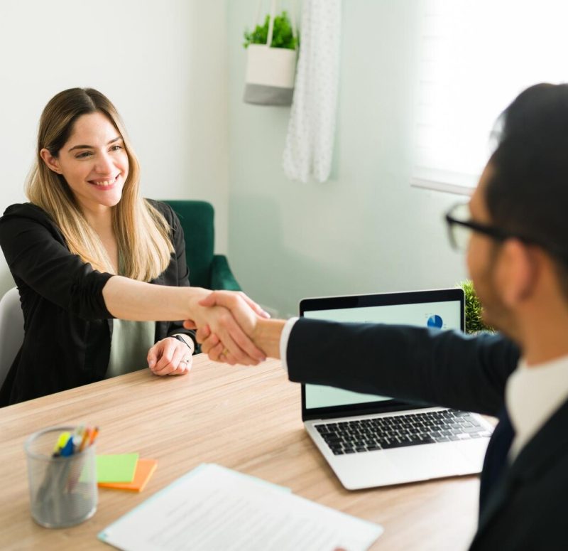 happy-caucasian-woman-shaking-hands-with-latin-man-business-meeting-with-lawyer-manager-hiring-beautiful-professional-woman-new-job_662251-184